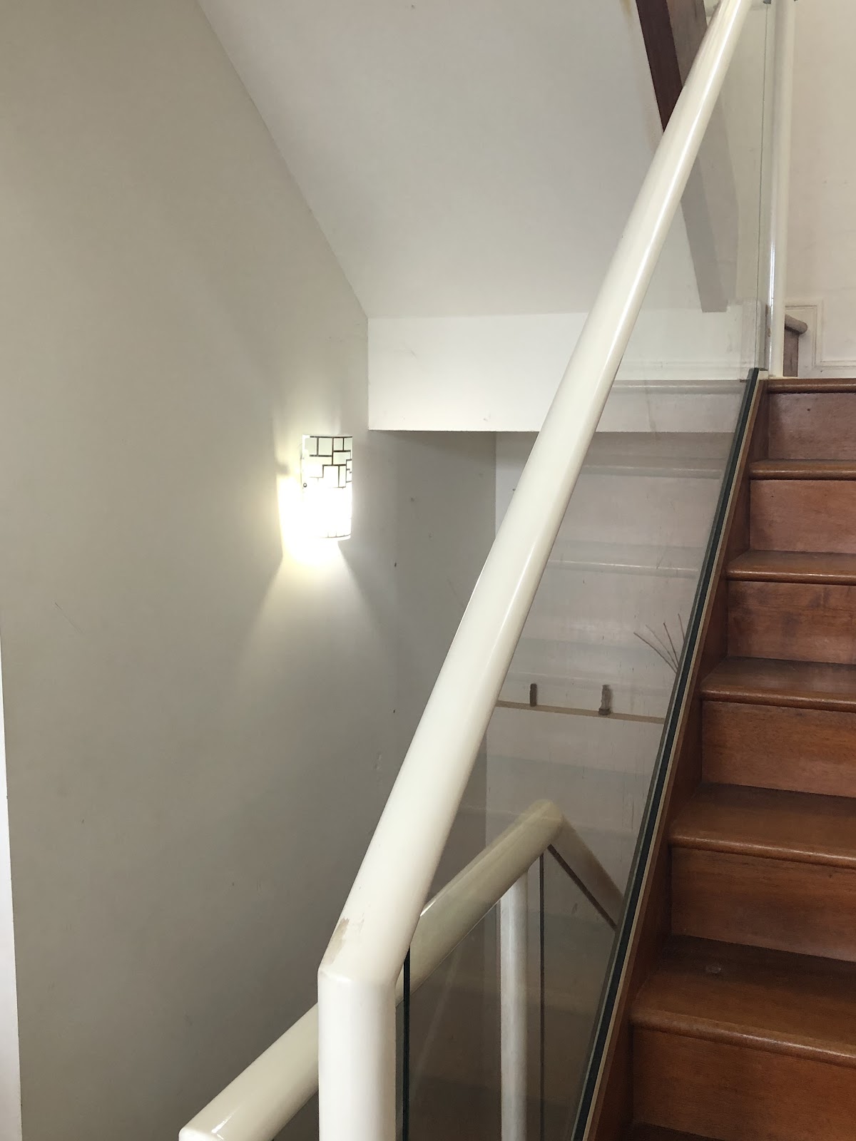 Crystal wall light on a stairwell landing